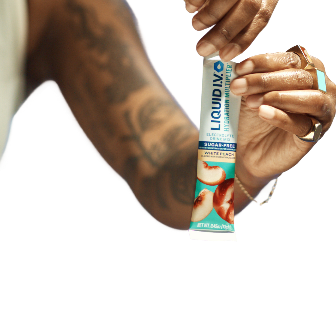 Hands opening a Liquid I.V. hydration stick